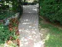 pavers through gate to backyard